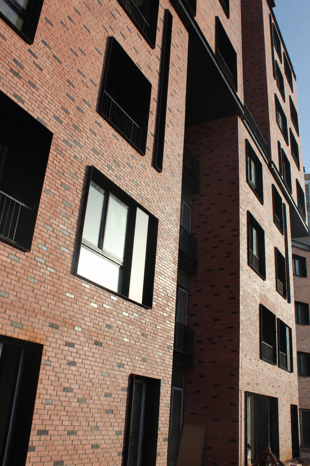 Warm brick cladding on a contemporary building façade