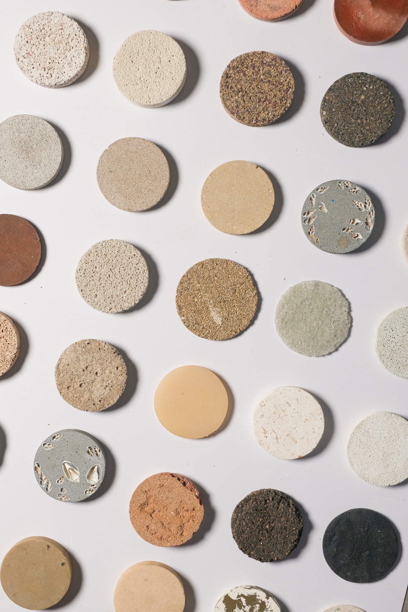 EarthCast circular material samples in varied earthy tones and textures