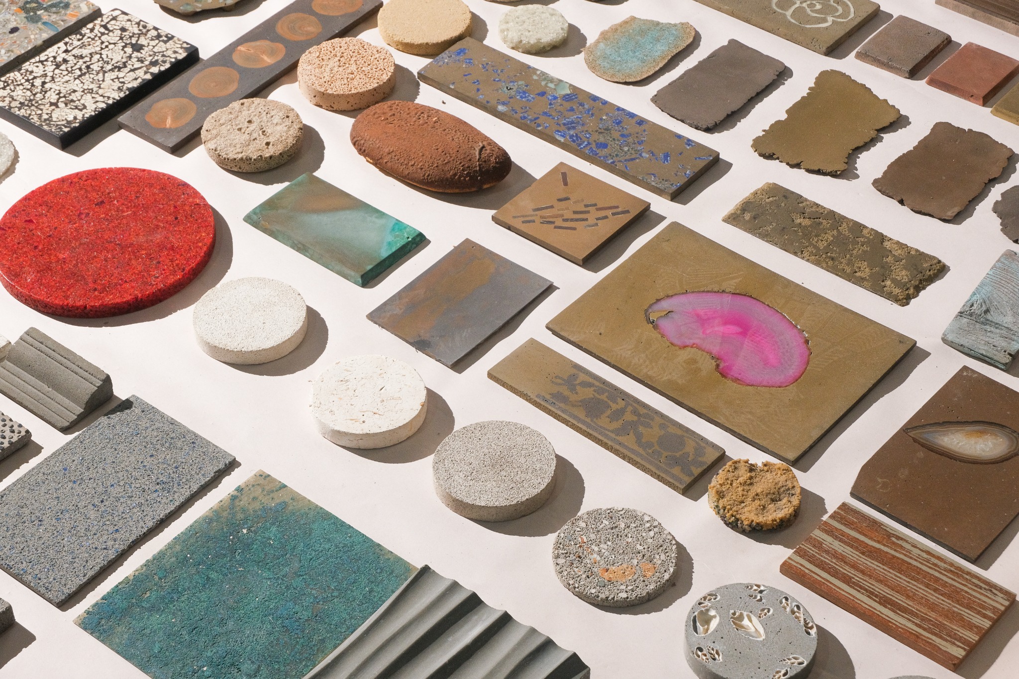 Flat composite material samples in a range of colors and textured finishes