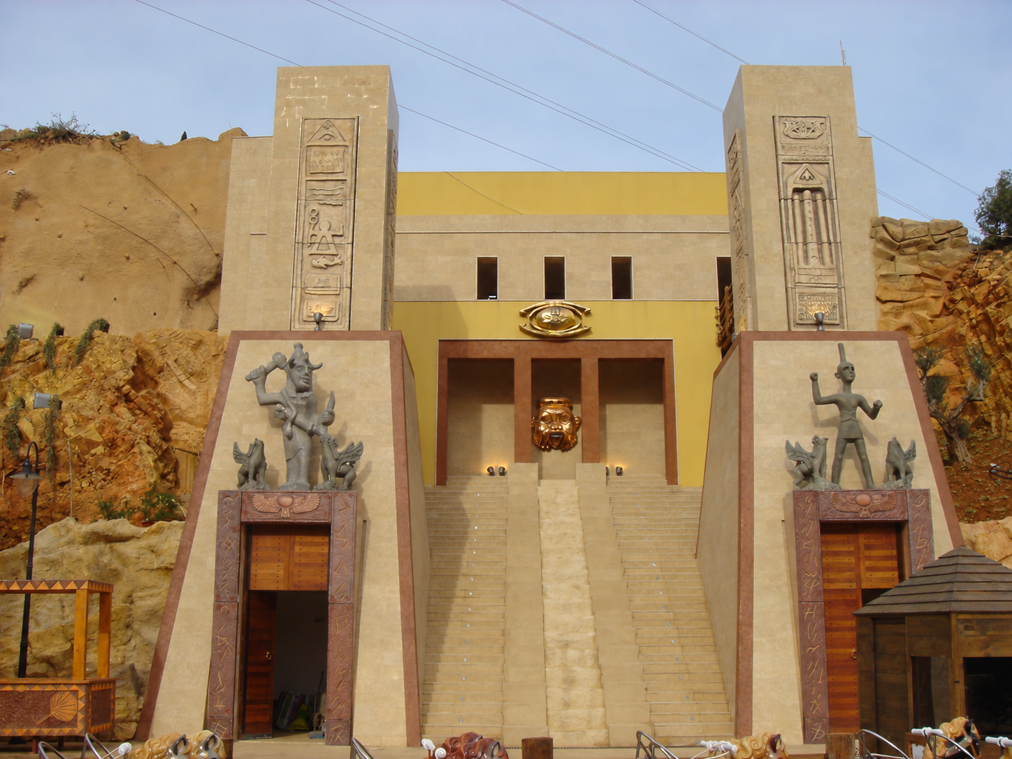 Architectural façade with Egyptian-inspired reliefs and sculptural elements